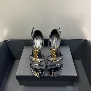 Yves Saint Laurent Glossy Black Heels with Iconic Gold Logo